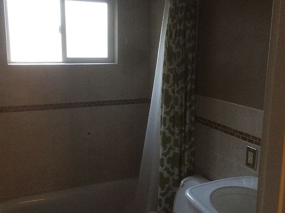 Mainfloor bathroom double headed tile shower