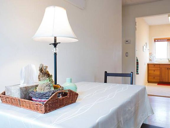 From dining area to kitchen. Great lighting throughout condo.