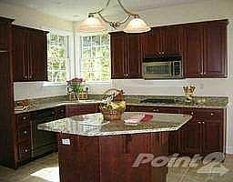 Gourmet kitchen w/solid cherry cabinets and granite countertops