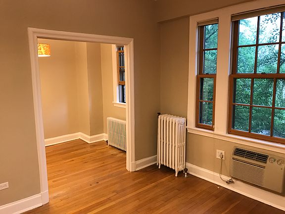 Left a view of the dining area off the kitchen. Dining area has room for a small table and chairs, plus a counter space with a stool.