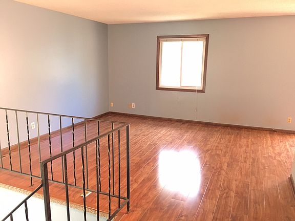 Gleaming new hardwood floors in living area