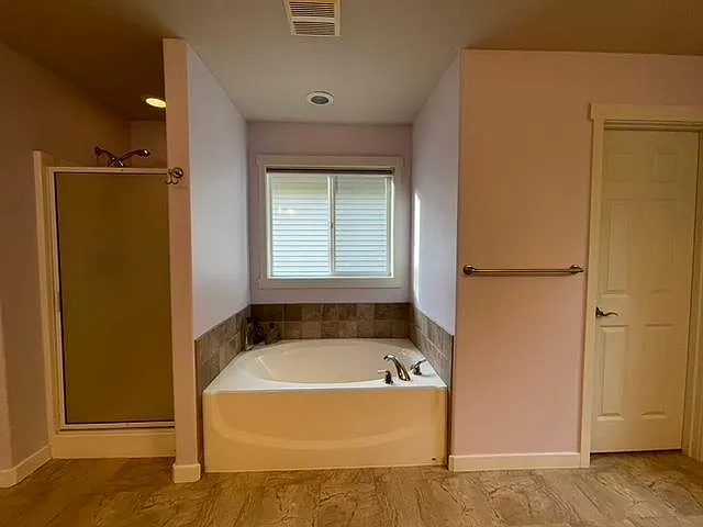Shower, Soaking tub and Toilet in the Master Bath