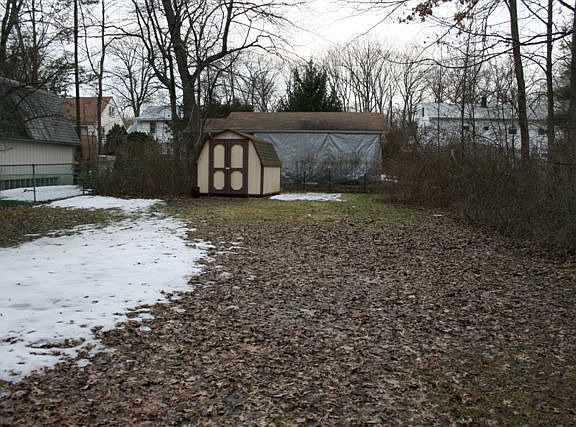 LARGE BACK YARD W/ STORAGE SHED
