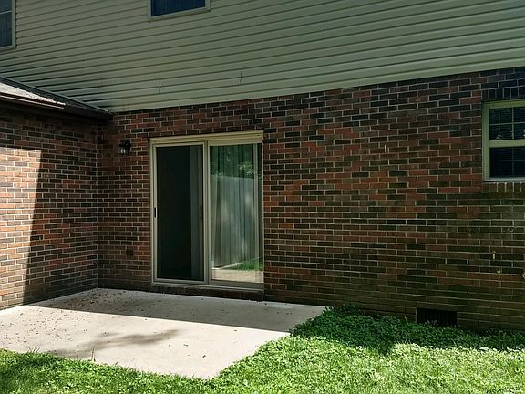 SIT ON THE PATIO AND ENJOY THE FALL COLORS. TREES ARE LINES BEHIND THE TOWNHOUSE. GREAT PLACE FOR A FIRE PIT & HOT DOGS.