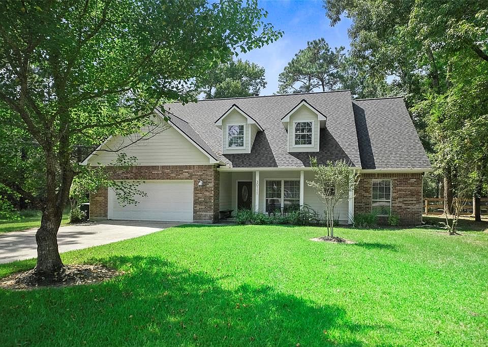 Appealing shade trees surround the quaint home and property.
