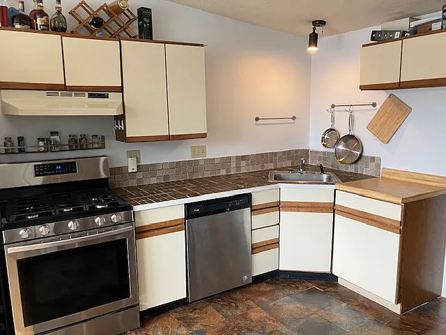 Kitchen with stainless steel appliances and generout counter space