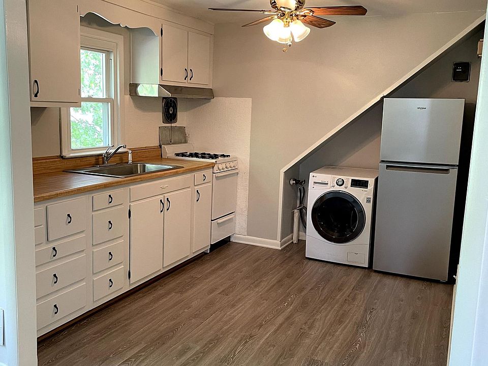 New vinyl plank flooring, two-in-one washer/dryer, and refrigerator.
