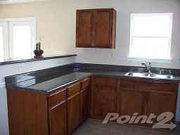 Kitchen w/View to Familyrm