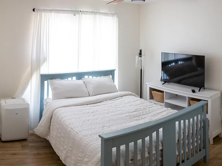 2nd bedroom, full bed frame (frame can be included if wanted, no mattress and TV included), window AC unit, closet, and 3 drawer dresser not pictured.