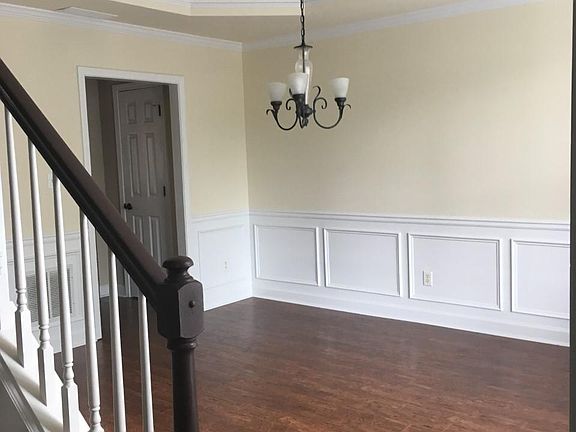 Formal dining to the right of front entrance with view of one of two pantries