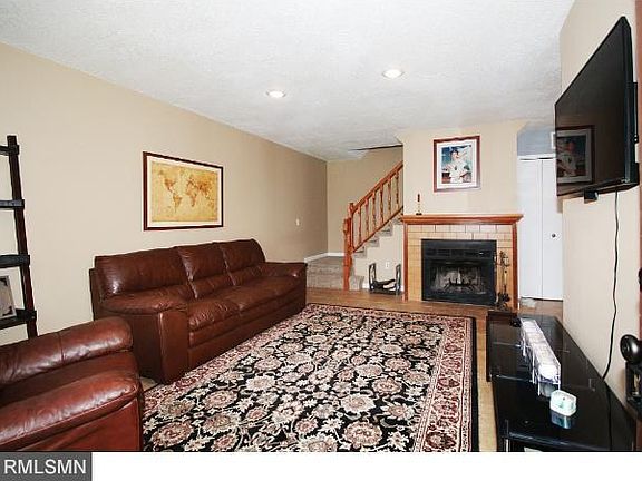 Living Room with fireplace, new recessed lighting, floor tile