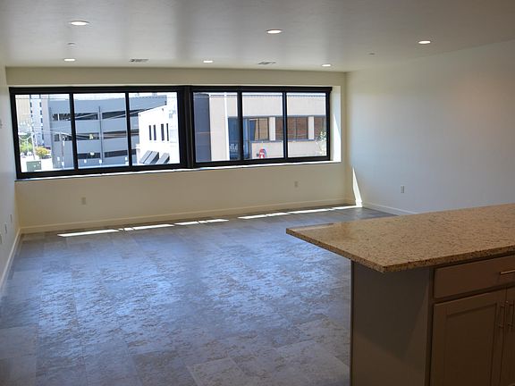 20 x 20 Living/Dining area with south facing views of Downtown, sliding windows and solar shades