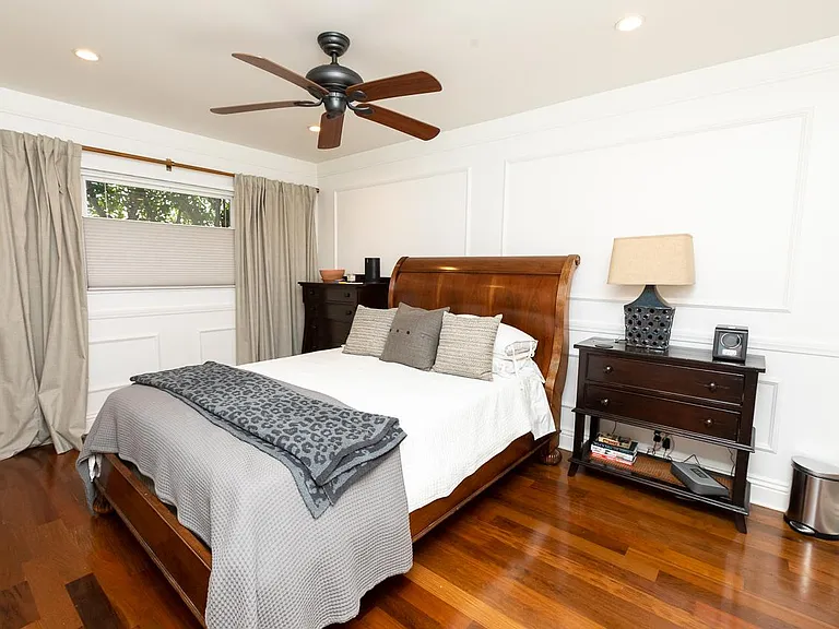 Primary bedroom with ceiling fan