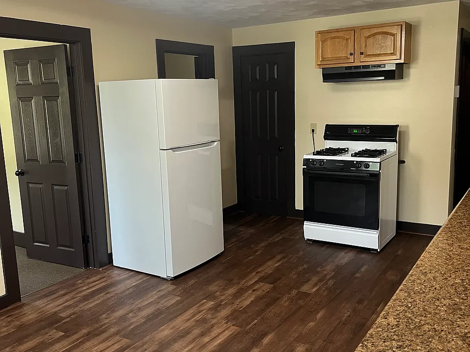 Kitchen, view shows the middle and back bedroom doors, and kitchen pantry door.