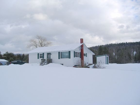 Front from road showing big front lawn