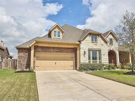 Spacious driveway leads you to a two car garage that features a major wow factor inside!