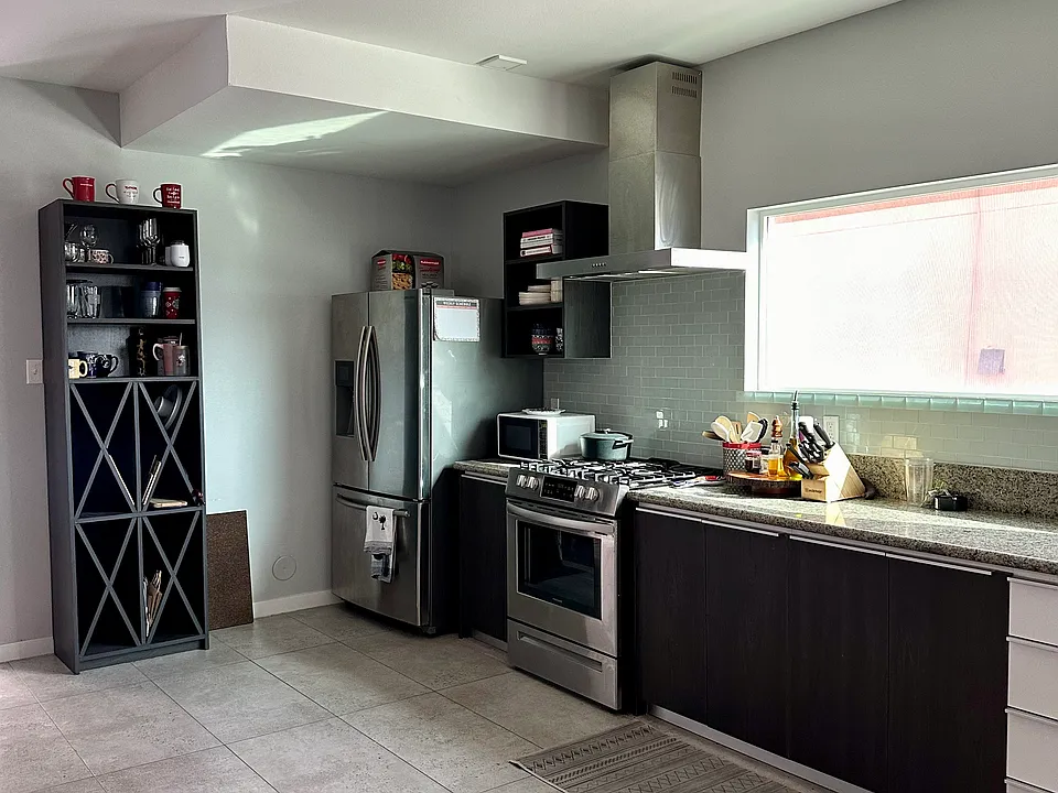 Stainless Steel kitchen with refrigerator and gas stove