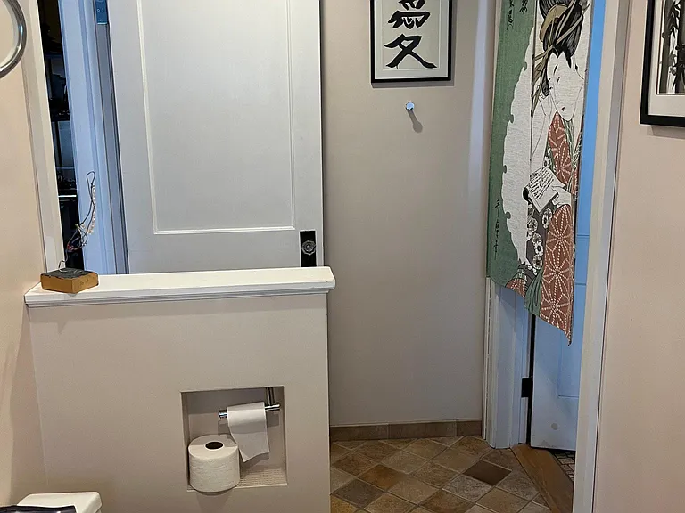 3rd floor bathroom with doorway to laundry