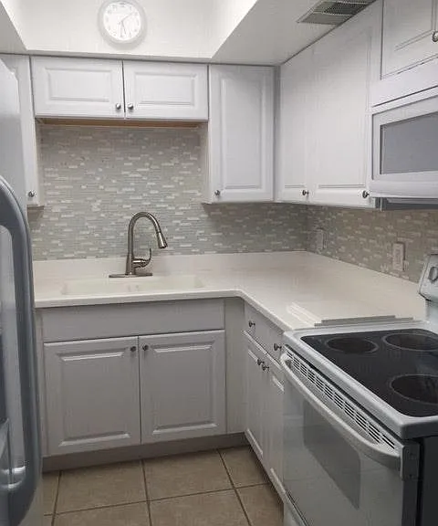Kitchen with Microwave, Stove and Filtered Water