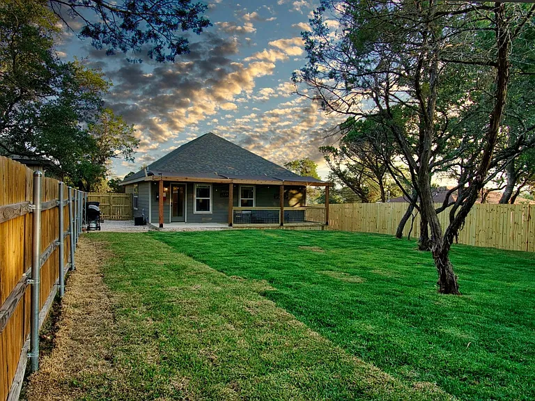 Enjoy the spacious fully fenced backyard featuring a covered patio perfect for relaxing or entertaining.