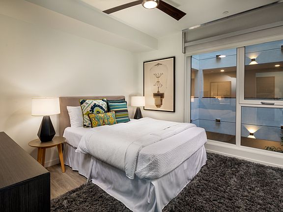 Picasso Apartments Bedroom area with window and view