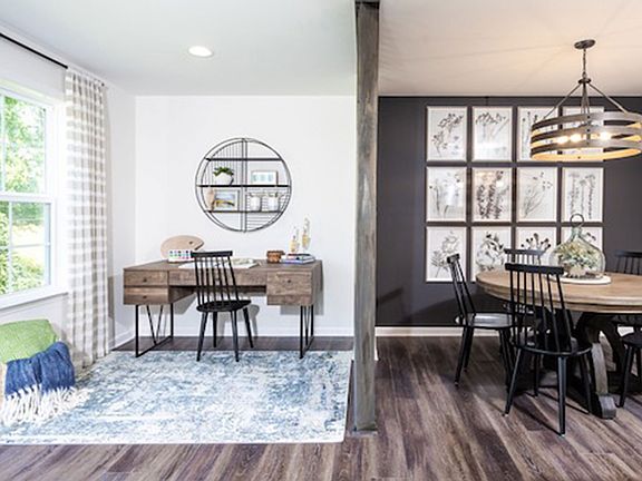 Breakfast area and 8 ft. sunroom extension in a DRB Homes York II Garage Model.
