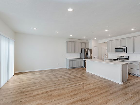 Sleek Kitchen Featuring Stainless Appliances & Center Island _ Perfect for Cooking and Entertaining