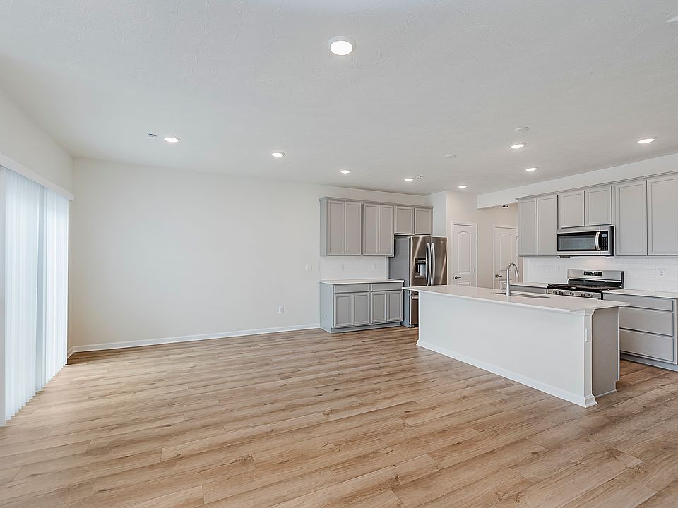Sleek Kitchen Featuring Stainless Appliances & Center Island _ Perfect for Cooking and Entertaining