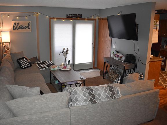 Main floor living room with entrance from patio.