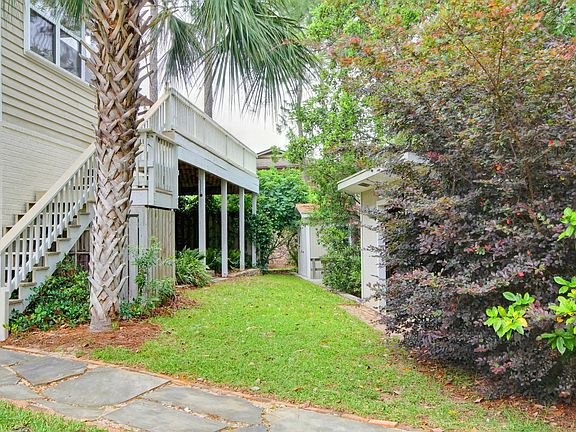 Backyard with upstairs deck