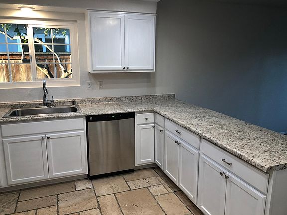 Brand new kitchen cabinets, counter top, and appliances.