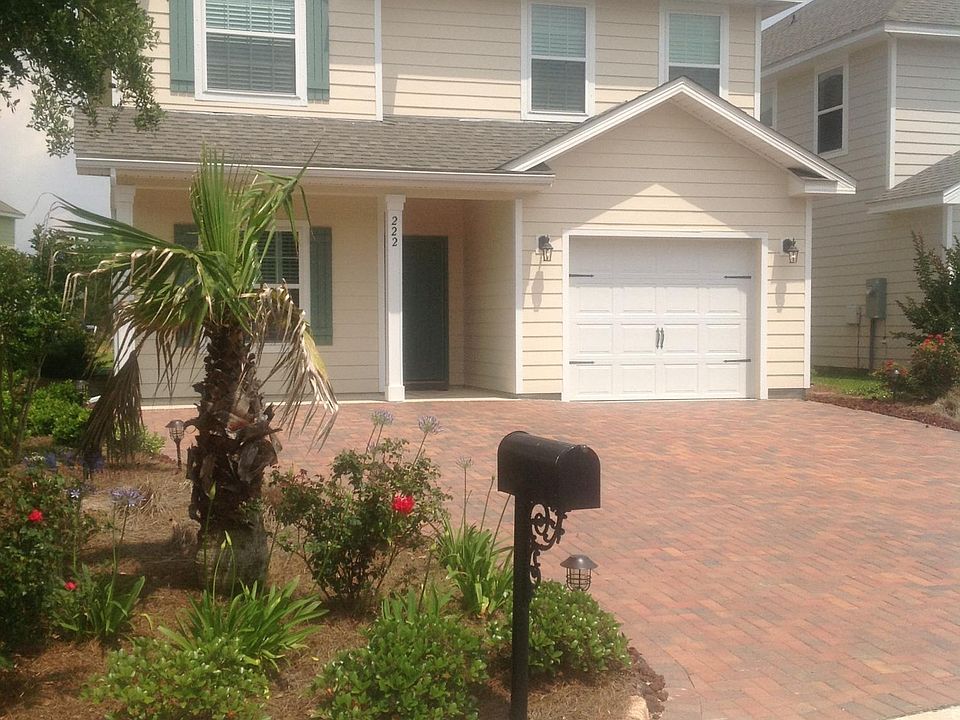 Front of property, large paver driveway parking for 3 vehicles