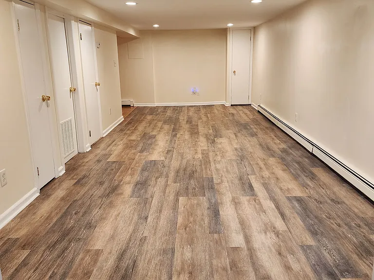 Living Room/dining area view from entry - Linen closet, mechanical room, bath doors on left in this view