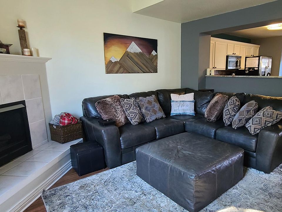 Living area with gas fireplace and cathedral ceiling