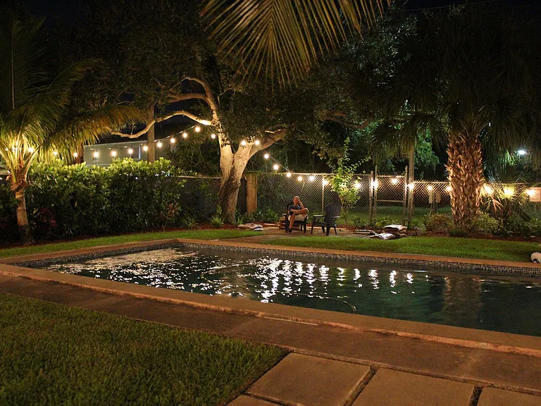 Lights strung around entire backyard. Pavers are being professionally installed now.