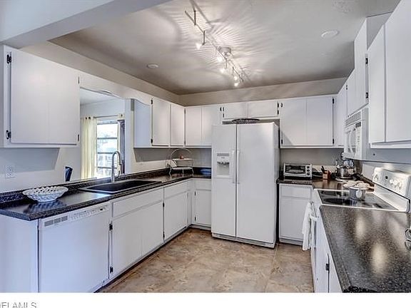 Kitchen opens to dining or family room.