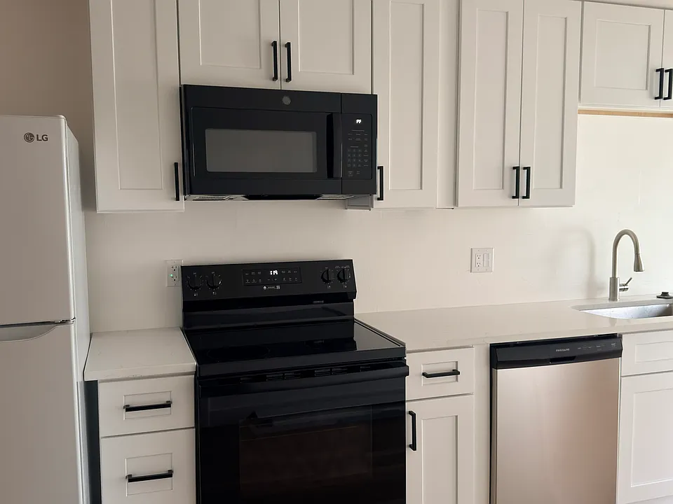 Bright, updated kitchen with brand new cabinets and appliances