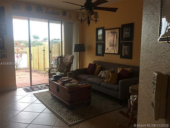 Family room with sliding door to the patio overlooking the large lake.