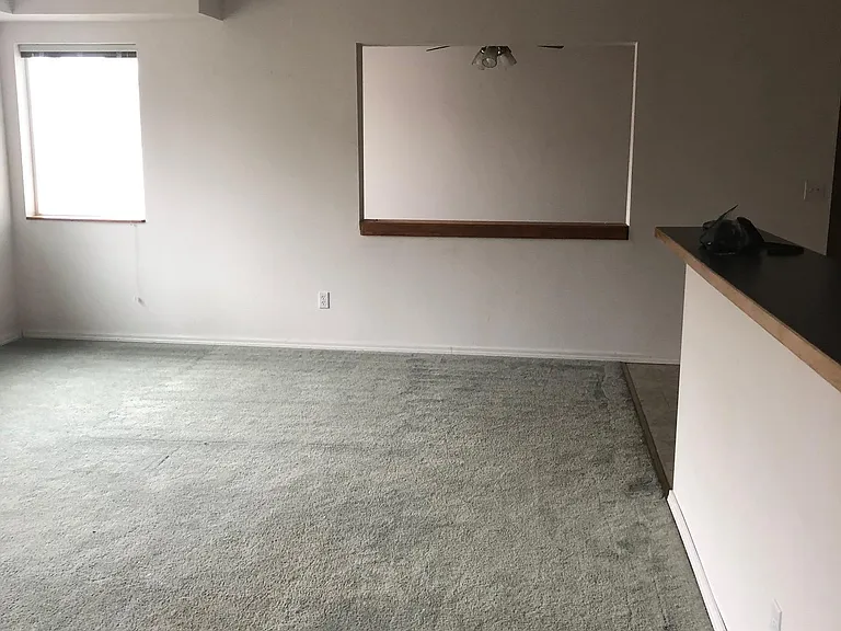 Large spacious living room area with breakfast bar