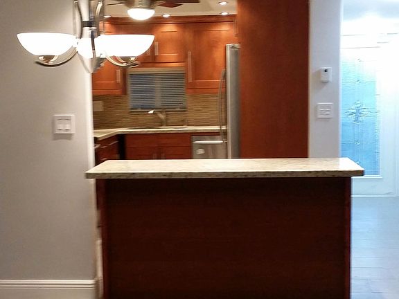 condo entrance, kitchen, dining area