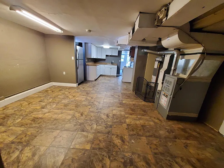 View from dining room looking towards kitchen and into living room.