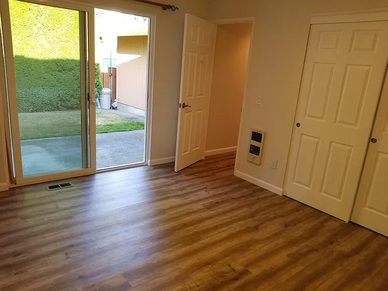 Master bedroom opens onto private backyard patio.