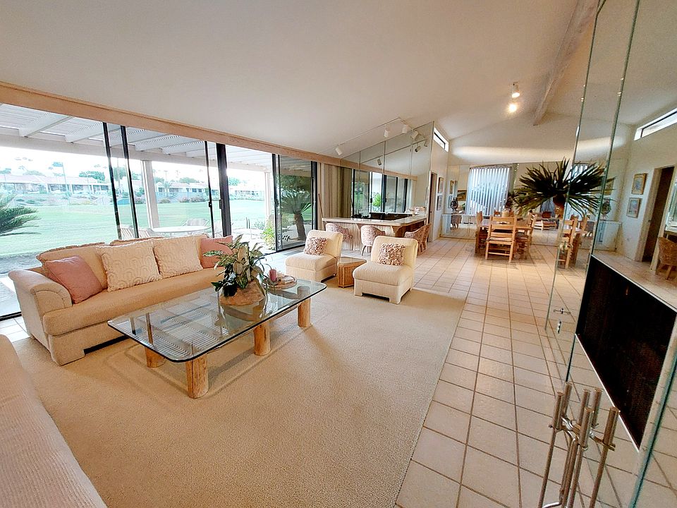 Large open floor plan with living/dining/ bar and sliding glass to open to outdoor patio