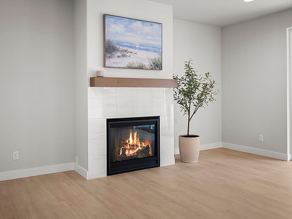 Cozy Fireplace that frames the living room perfect for your style!