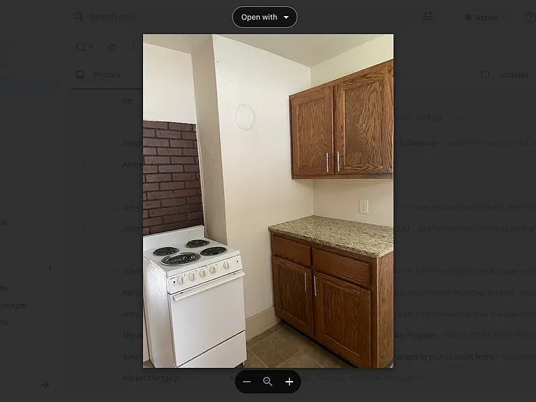 Custom cabinets and small 4 burner electric stove.
