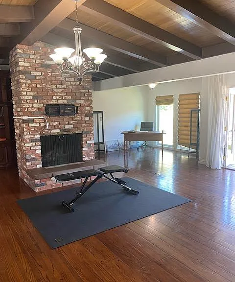 Great room with vaulted ceilings and brick fireplace