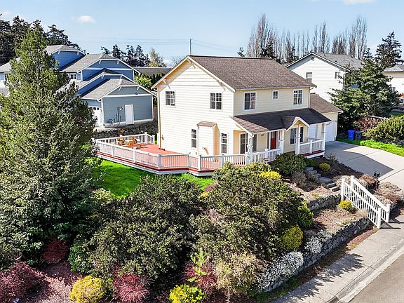 Enjoy peeks of the sound and a full wrap around deck.