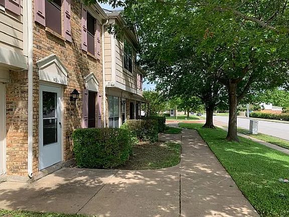 Front porch and yard are fully maintained by the HOA, offering low-maintenance living.