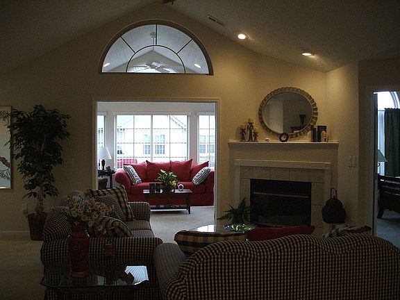 Great Room has cathedral ceiling, gas log fireplace, double doors to veranda.