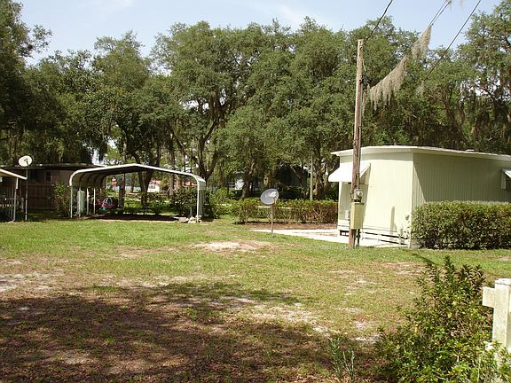 two car carport with lake behind
